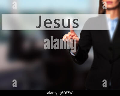 Jesus - Businesswoman hand pressing button on touch screen interface. Business, technology, internet concept. Stock Photo Stock Photo