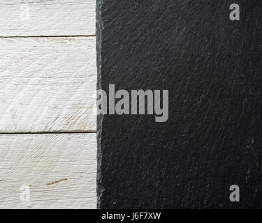 Background slate black on white painted board. View from above. Stock Photo