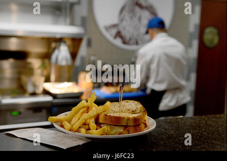 A reuben sandwich is prepared and served at McChord Grill, Joint Base Lewis-McChord, Washington, showcasing culinary skills and menu service at the base facility. Stock Photo