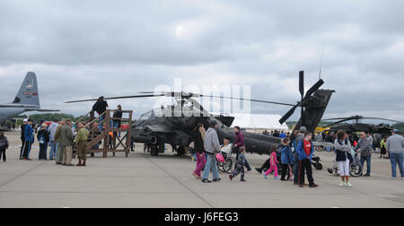 Spectators surround an apache helicopter belonging to the 2nd Infantry Brigade Combat Team, out of Johnstown, Pa., during the Wings Over Pittsburgh 2017 Air Show at the 911th Airlift Wing in Coraopolis, Pa., May 13, 2017. The air show was held May 13-14 and provided visitors a chance to speak face-to-face with pilots and other military personnel from the 911th Airlift Wing and the 171st Air Refueling Wing. (U.S. Army photo by Spc. Miguel Alvarez/Released) Stock Photo