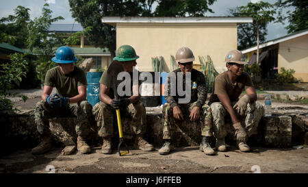 Philippine Army and U.S. Marine engineers collaborate on a civic assistance project during Balikatan 2017, building new classrooms for a local school in Ormoc City, Leyte. Stock Photo