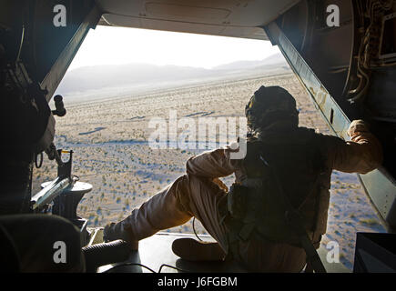 Sgt. Austin J. Otto, a crew chief with Marine Medium Tiltrotor Squadron (VMM) 363, participates in an MV-22 Osprey tail gun shoot during Integrated Training Exercise (ITX) 3-17, on Marine Corps Air Ground Combat Center Twentynine Palms, Calif., May 15. ITX is a combined-arms exercise enabling Marines across 3rd Marine Aircraft Wing to operate as an aviation combat element integrated with ground and logistics combat elements as a Marine air-ground task force. More than 650 Marines and 27 aircraft with 3rd MAW are supporting ITX 3-17. (U.S. Marine Corps photo by Lance Cpl. Becky L. Calhoun/Relea Stock Photo