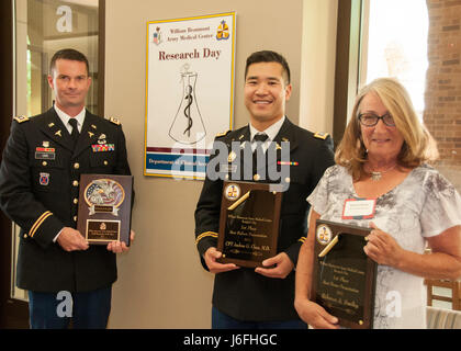 From left Lt. Col. Justin Orr staff researcher of the year Capt