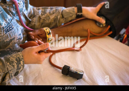 Air Force medical personnel from the 177th and 108th Fighter Wings provide healthcare to homeless veterans during Stand Down 2017 at the All Wars Memorial Building, Atlantic City, New Jersey, May 17, 2017, offering medical services and support. Stock Photo