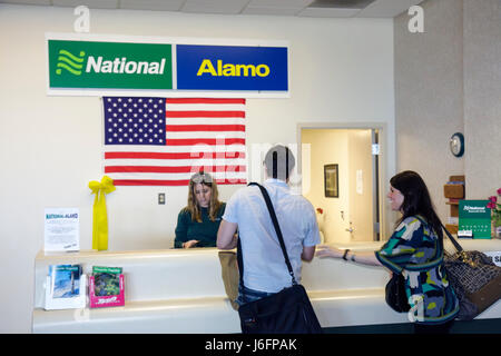 Michigan,MI,Mich,Upper Peninsula,U.P.,UP,Lake Superior,Marquette County,Marquette,Sawyer International Airport,rental car,counter,National,Alamo,man m Stock Photo