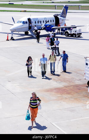 Florida Pensacola,Pensacola Regional Airport,Continental Airlines,Connection,commuter flight,aircraft,tarmac,adult adults woman women female lady,man Stock Photo