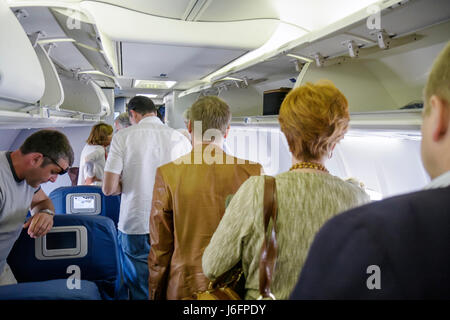 Atlanta Georgia,Hartsfield Jackson Atlanta International Airport,Delta Airlines,man men male,woman female women,overhead compartment,commercial airlin Stock Photo