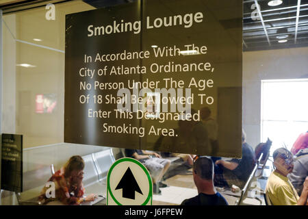 Atlanta Georgia,Hartsfield Jackson Atlanta International Airport,smoking lounge,vice,addiction,restriction,warning sign,underage,designated area,secon Stock Photo