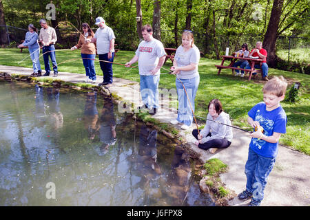 Sevierville Tennessee,Smoky Mountains,English Mountain Trout Farm and Grill,catch,eat,rainbow rainbows trout,fishing,boy boys,male kid kids child chil Stock Photo