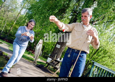 Sevierville Tennessee,Smoky Mountains,English Mountain Trout Farm & Grill,catch,eat,rainbow trout,man men male,woman female women,couple,catch,camera, Stock Photo