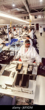 Fremont, California, USA. 15th July, 1998. Business, Solectron, Factories. Female workers on assembly line. Silicon Valley factories sub-contract manufacturing parts for computers, pagers, printers and electronics. Credit: Mark Richards/ZUMA Wire/ZUMAPRESS.com/Alamy Live News Stock Photo