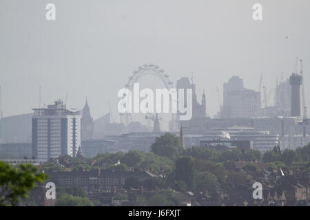 London, UK. 21st May, 2017. London skyline seen from Wimbledon bathed in hazy morning sunshine as temperatures are forecast to increase to mid 20s over the the next week in London and across much of Britain Credit: amer ghazzal/Alamy Live News Stock Photo