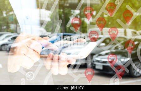 Car sharing service or rental concept. Sharing economy and collaborative consumption. Double exposure of business man holding mobile phone and use app Stock Photo