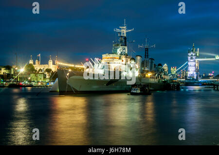 H.M.S. Belfast on River Thames at night. London, UK. Stock Photo