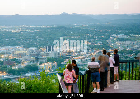 Roanoke Virginia,Mill Mountain Overlook,man men male,woman female women,couple,families,view,downtown,city,dusk,evening,Allegheny Mountains,Blue Ridge Stock Photo