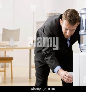 office inside drink drinking bibs female male masculine person blank european Stock Photo