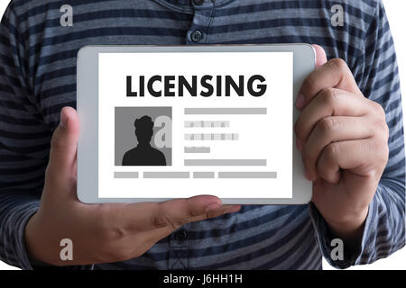 Patent License agreement LICENSING   business man hand working on laptop computer Stock Photo