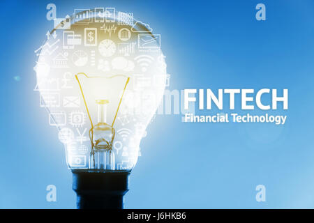 Fintech concept. Icons of financial technology and bank . Light bulb , Infographic , texts and icons on blue background Stock Photo
