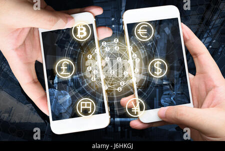Two Businessman hands holding smartphones. Fintech concept , Peer-to-peer concept with map and world connect , hi-tech building abstract background Stock Photo