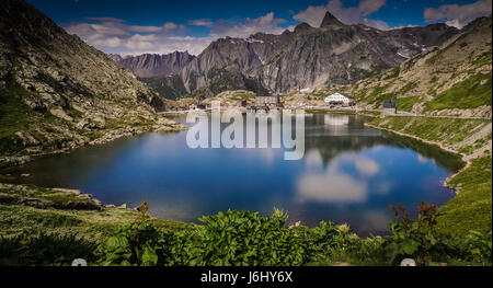 Looking over Lac du Grand Saint-Bernard from Switzerland to Italy Stock Photo