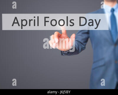 April Fools Day - Businessman press on digital screen. Business,  internet concept. Stock Photo Stock Photo
