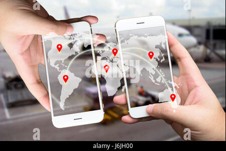 Two Businessman hands holding smartphones. Fintech concept , Peer-to-peer , logistic concept with map and world connect , airplane in airport blue bac Stock Photo