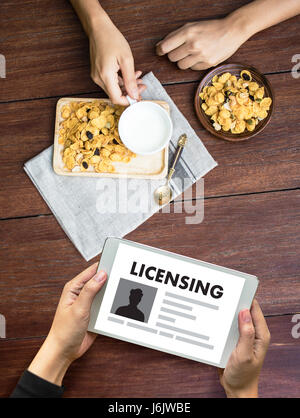 Patent License agreement LICENSING   business man hand working on laptop computer Stock Photo