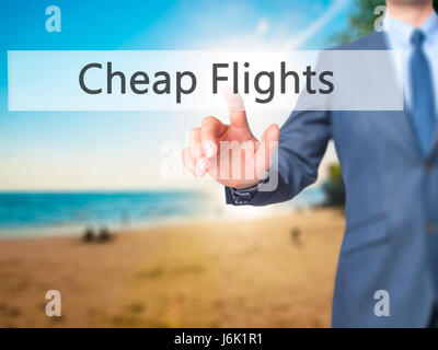 Cheap Flights - Businessman press on digital screen. Business,  internet concept. Stock Photo Stock Photo