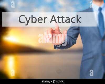 Cyber Attack - Businessman hand pushing button on touch screen. Business, technology, internet concept. Stock Image Stock Photo