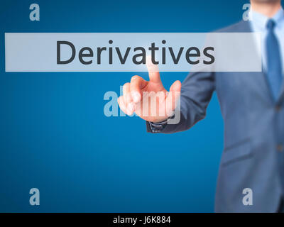 Derivatives - Businessman hand pushing button on touch screen. Business, technology, internet concept. Stock Image Stock Photo