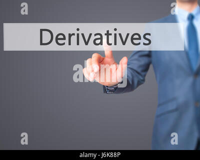 Derivatives - Businessman hand pushing button on touch screen. Business, technology, internet concept. Stock Image Stock Photo