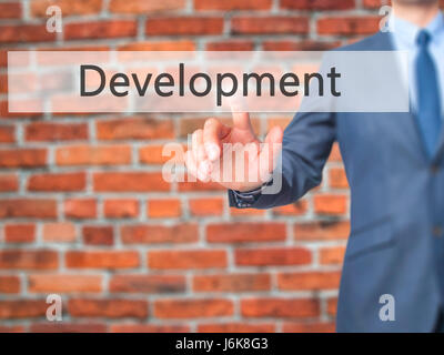 Development - Businessman press on digital screen. Business,  internet concept. Stock Photo Stock Photo