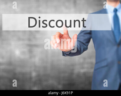 Discount - Businessman hand pushing button on touch screen. Business, technology, internet concept. Stock Image Stock Photo