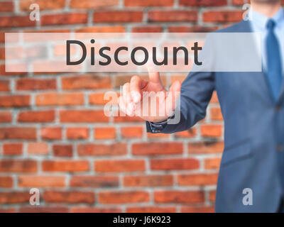 Discount - Businessman hand pushing button on touch screen. Business, technology, internet concept. Stock Image Stock Photo