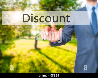 Discount - Businessman hand pushing button on touch screen. Business, technology, internet concept. Stock Image Stock Photo
