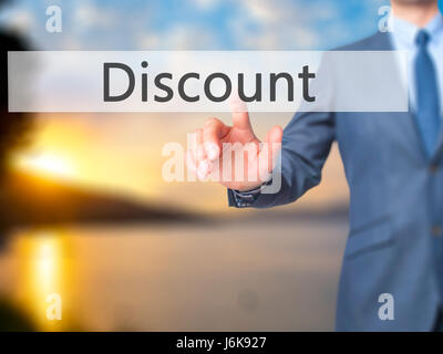 Discount - Businessman hand pushing button on touch screen. Business, technology, internet concept. Stock Image Stock Photo