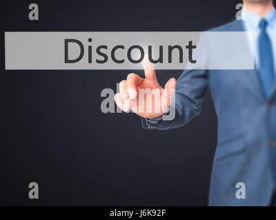 Discount - Businessman hand pushing button on touch screen. Business, technology, internet concept. Stock Image Stock Photo