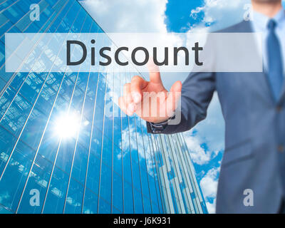 Discount - Businessman hand pushing button on touch screen. Business, technology, internet concept. Stock Image Stock Photo