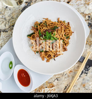 Noodles with duck meat, chicken, shiitake mushrooms Stock Photo