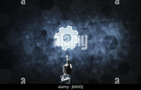 Technology conceptual image with gear digital symbol on dark bac Stock Photo