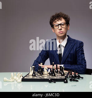 Studio portrait of successful man playing chess Stock Photo