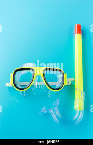 sport, fitness, water sports and objects concept - close up of swimming goggles on the blue background Stock Photo