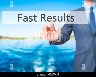 Fast Results - Businessman hand pressing button on touch screen interface. Business, technology, internet concept. Stock Photo Stock Photo