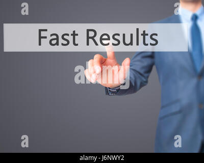 Fast Results - Businessman hand pressing button on touch screen interface. Business, technology, internet concept. Stock Photo Stock Photo