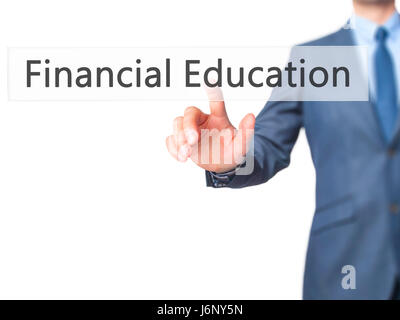 Financial Education - Businessman hand pressing button on touch screen interface. Business, technology, internet concept. Stock Photo Stock Photo