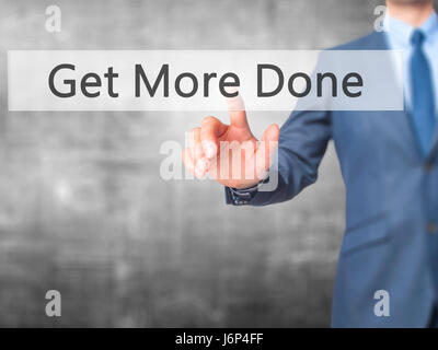 Get More Done - Businessman hand pressing button on touch screen interface. Business, technology, internet concept. Stock Photo Stock Photo