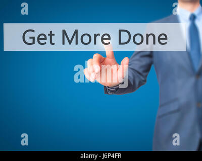 Get More Done - Businessman hand pressing button on touch screen interface. Business, technology, internet concept. Stock Photo Stock Photo