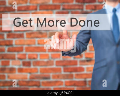 Get More Done - Businessman hand pressing button on touch screen interface. Business, technology, internet concept. Stock Photo Stock Photo