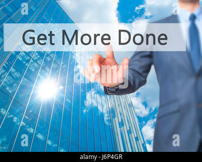 Get More Done - Businessman hand pressing button on touch screen interface. Business, technology, internet concept. Stock Photo Stock Photo
