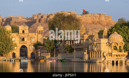 Gadi Sagar (Gadisar) Lake is one of the most important tourist attractions in Jaisalmer, Rajasthan, India. Artistically carved temples and shrines aro Stock Photo